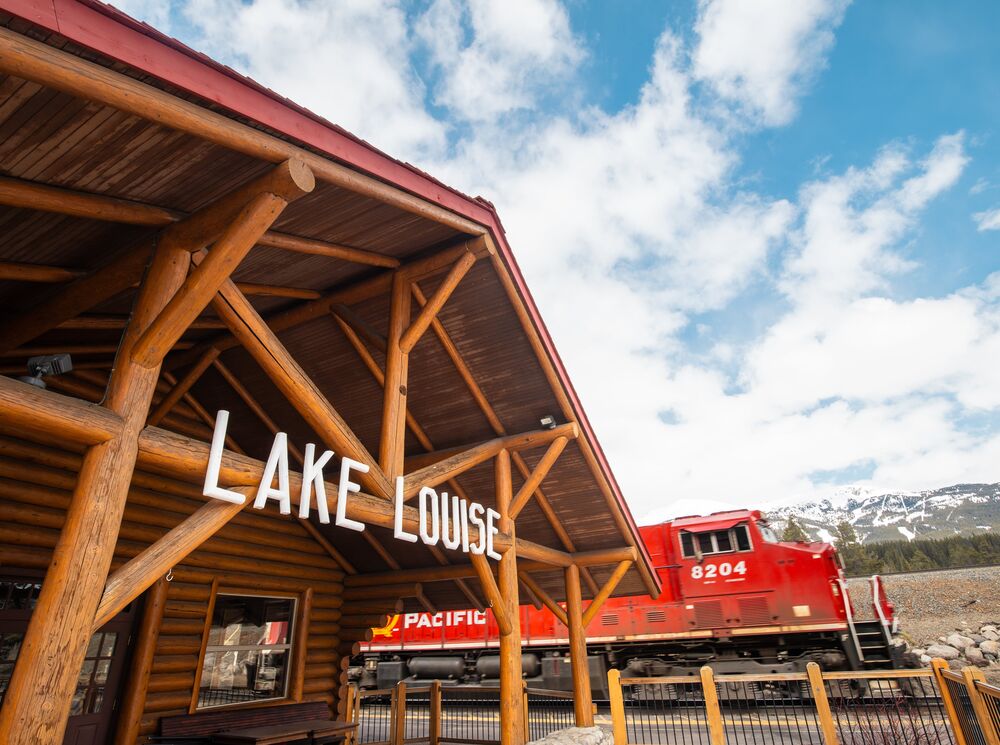 Historic train station restaurant in Lake Louise with mountain views and vintage railcar dining